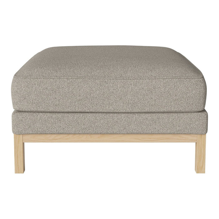 Light gray upholstered ottoman with a smooth texture and natural wood legs, perfect for modern decor.