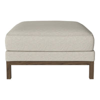 Beige upholstered ottoman with a smooth texture and a wooden base, perfect for modern decor.