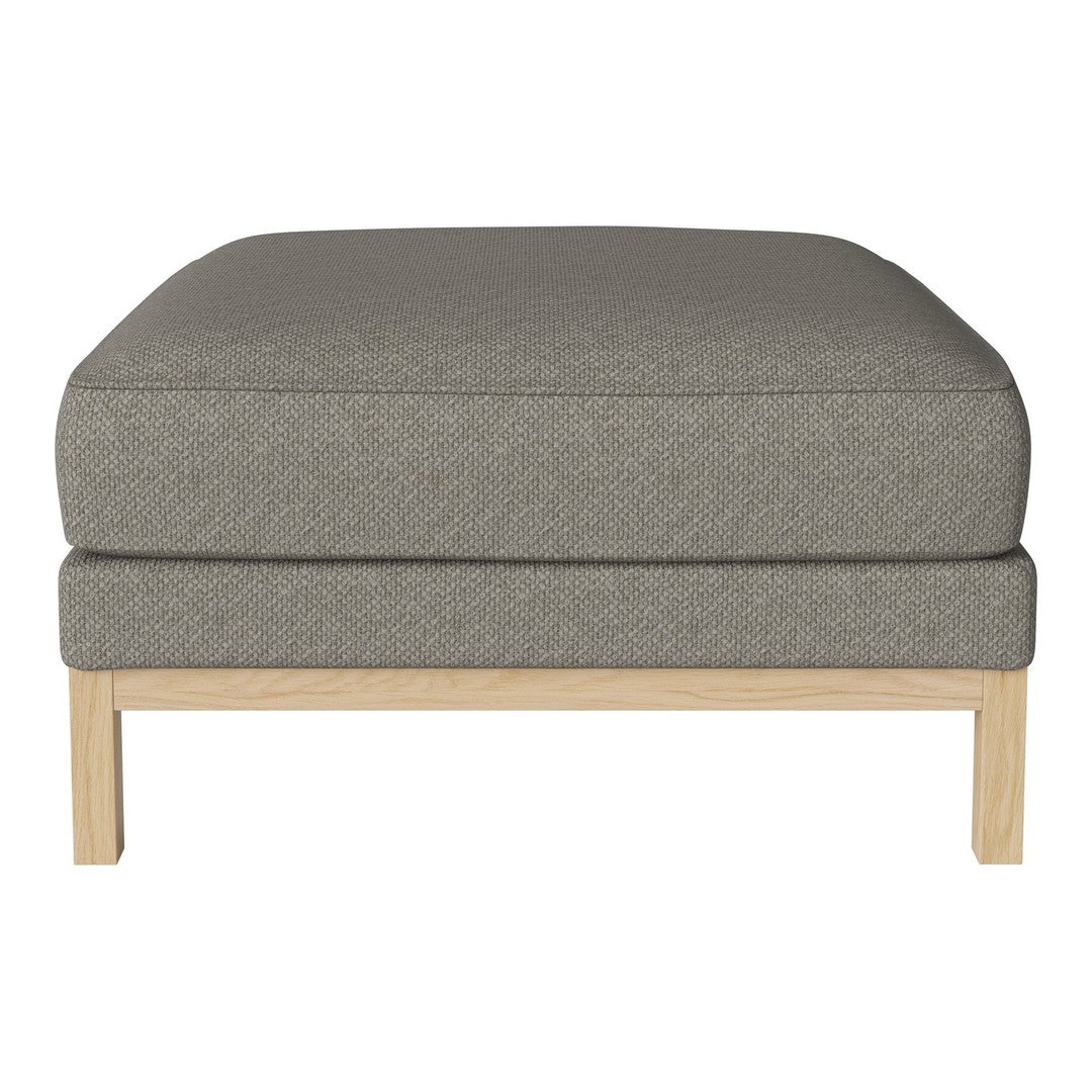 Gray upholstered ottoman with a smooth texture and light wood legs. Modern, minimalist design ideal for any decor.