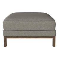 Gray upholstered ottoman with a textured fabric and wooden legs, offering a modern and minimalist design.