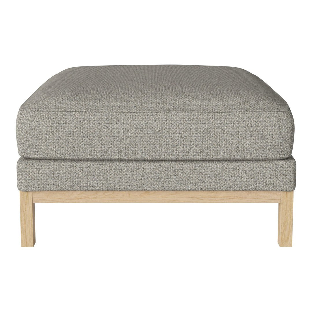 Gray upholstered ottoman with a subtle textured pattern and light wood legs. Perfect for modern decor.