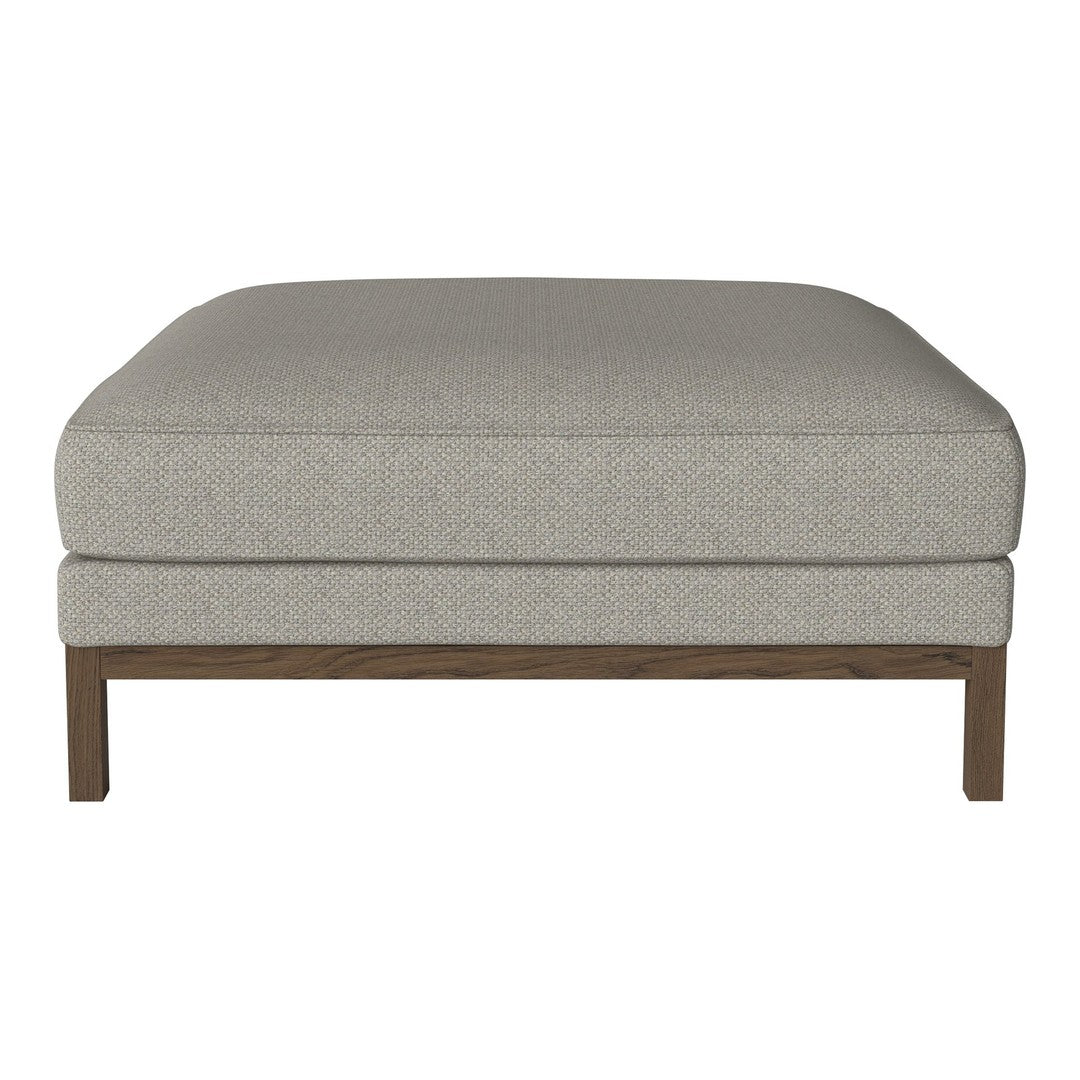 Light gray upholstered ottoman with subtle texture, featuring a sleek wooden base, perfect for modern decor.