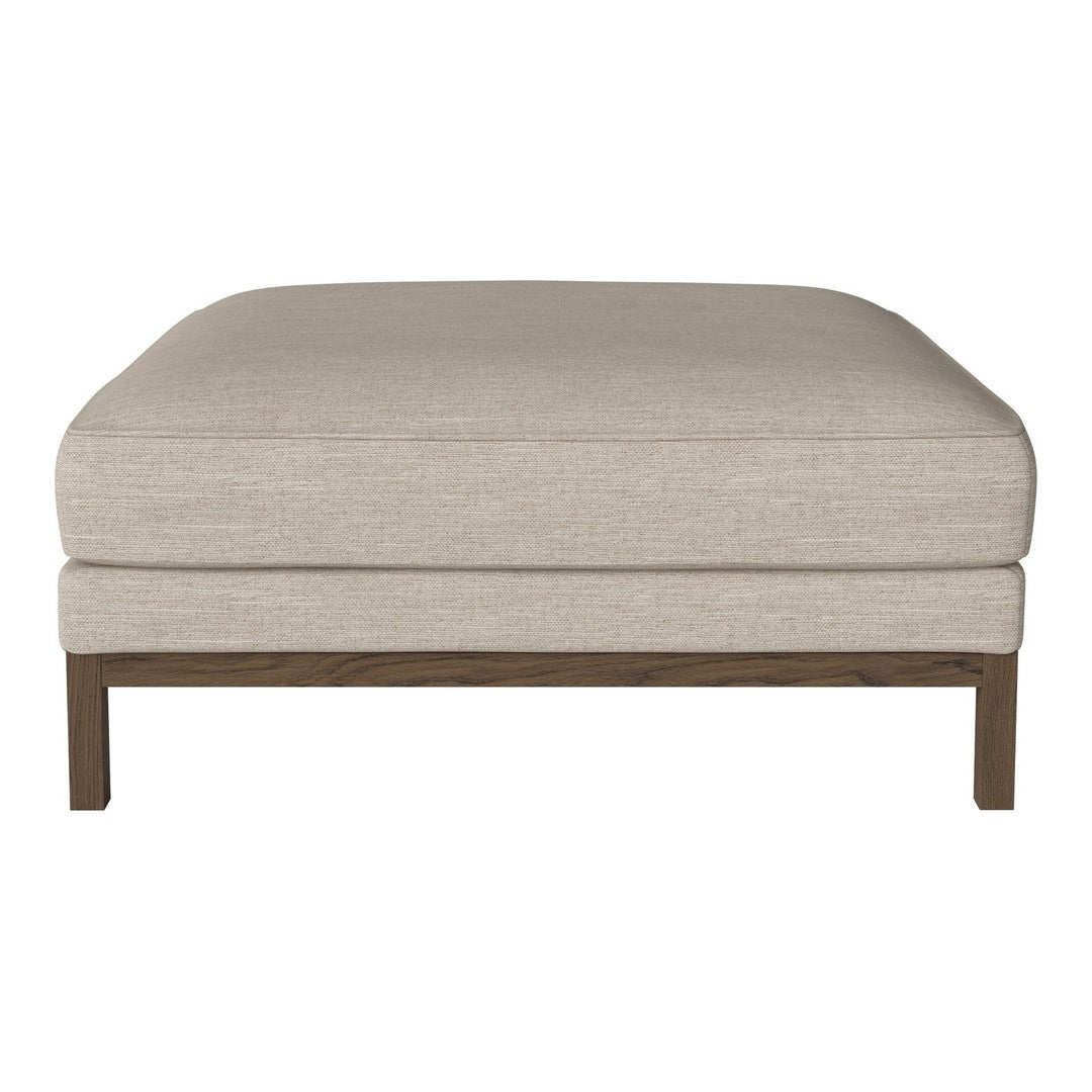 Beige upholstered ottoman with a smooth texture and wooden frame, featuring a minimalist design and neutral tones.