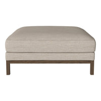Beige upholstered ottoman with a smooth texture and wooden frame, featuring a minimalist design and neutral tones.