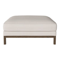 White upholstered ottoman with a smooth surface and a dark wood base, showcasing a minimalist design.