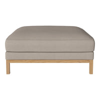 Beige cushioned ottoman with a smooth texture, featuring a light wooden base and minimalist design.