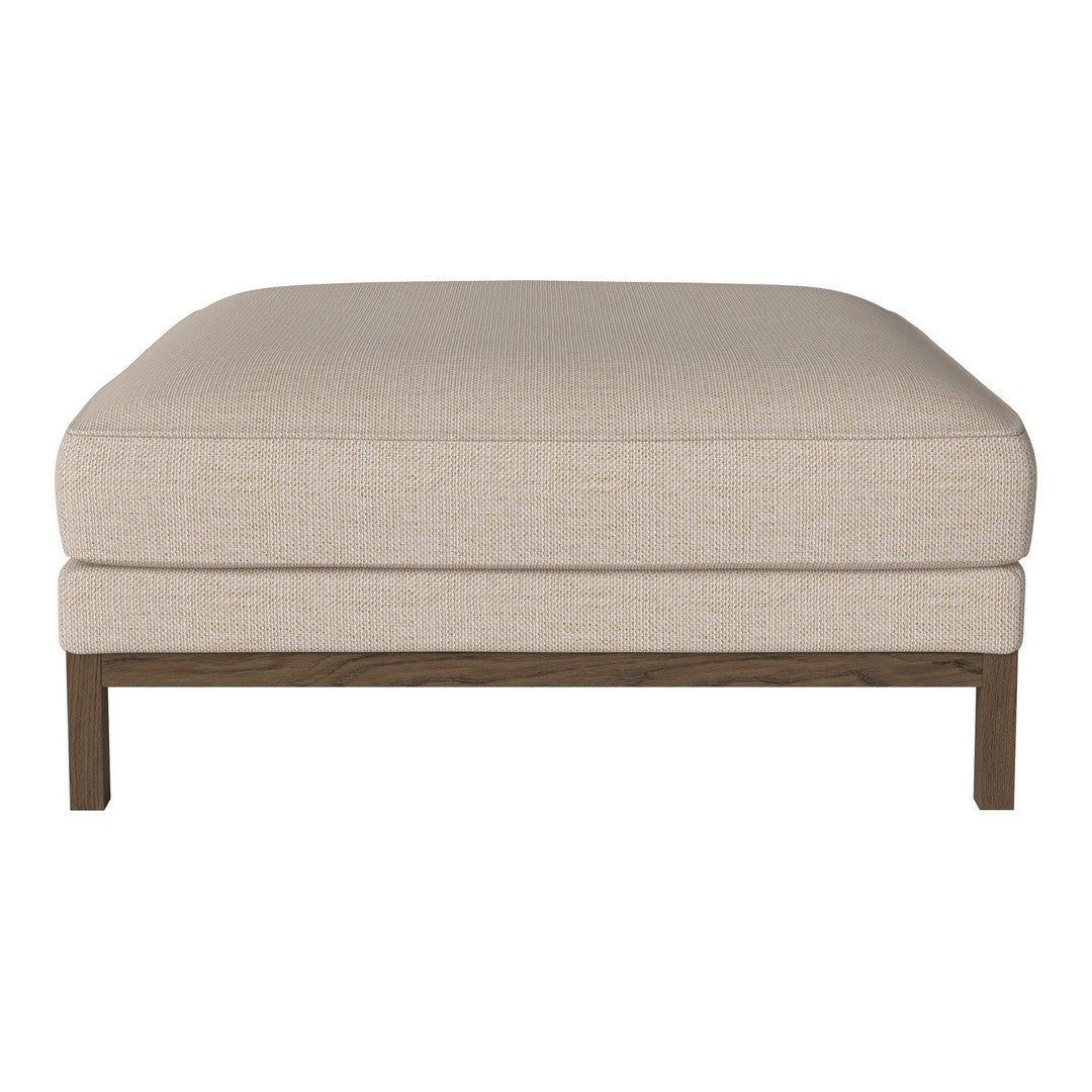 Beige upholstered ottoman with a simple, textured surface and a wooden base. Perfect for any modern decor.