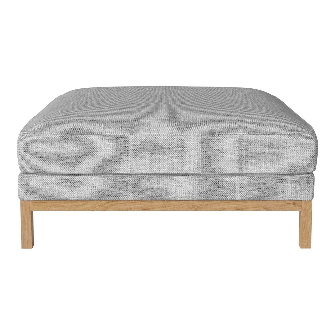 Gray upholstered ottoman with a smooth texture and light wooden legs, perfect for modern decor.
