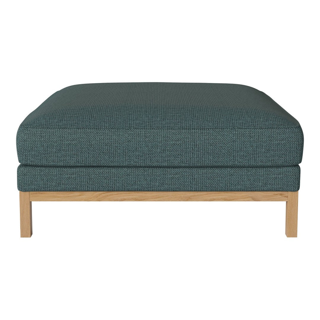Teal upholstered ottoman with a textured pattern and light wooden legs, adding a modern touch to any space.