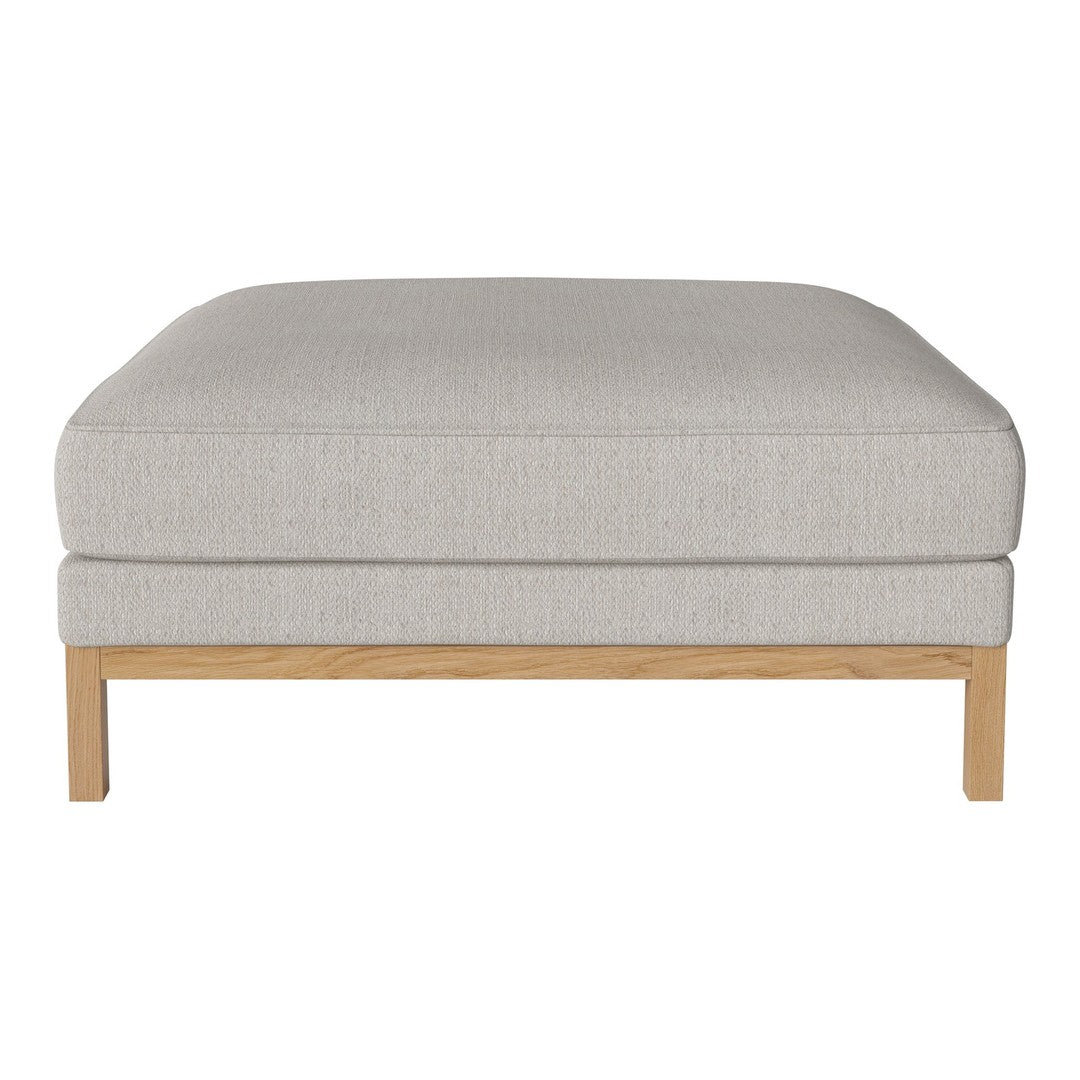 Light grey upholstered ottoman with a textured fabric and natural wooden legs, ideal for modern decor.