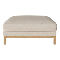 Beige upholstered ottoman with a smooth texture and light wood legs, perfect for modern decor.