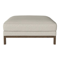 Beige upholstered ottoman with a subtle textured pattern and wooden legs, perfect for modern living spaces.