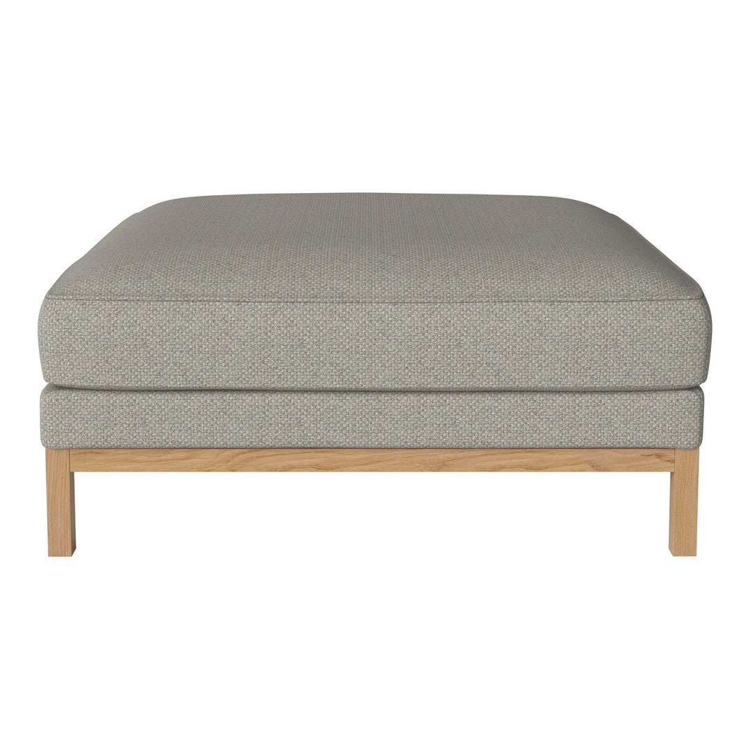 Light gray upholstered ottoman with a smooth, minimalist design and natural wood legs. Ideal for modern decor.