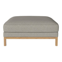 Light gray upholstered ottoman with a smooth, minimalist design and natural wood legs. Ideal for modern decor.