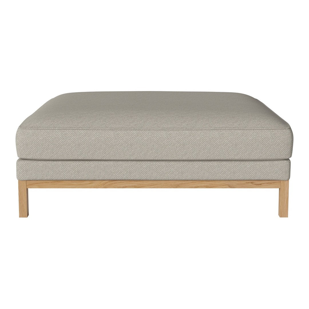 Light gray upholstered ottoman with a smooth texture and natural wood legs, enhancing modern decor.
