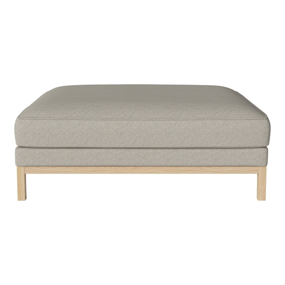 Light beige ottoman with a smooth fabric texture and clean wooden legs, perfect for modern minimalist decor.