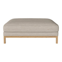 Beige upholstered ottoman with a minimalist wooden base, featuring a sleek, solid pattern. Ideal for modern decor.