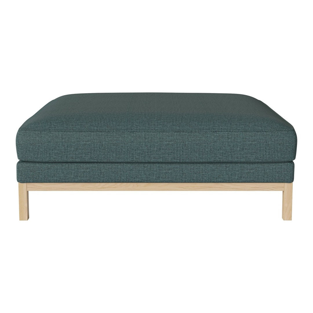 Teal patterned ottoman with a light wood base, featuring a minimalist design for modern decor.