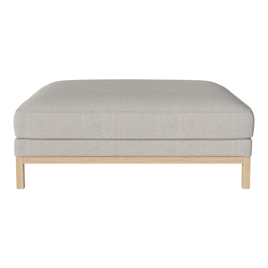 Light gray upholstered ottoman with a smooth fabric texture and natural wood base. Ideal for modern decor.