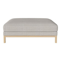 Light gray upholstered ottoman with a smooth fabric texture and natural wood base. Ideal for modern decor.