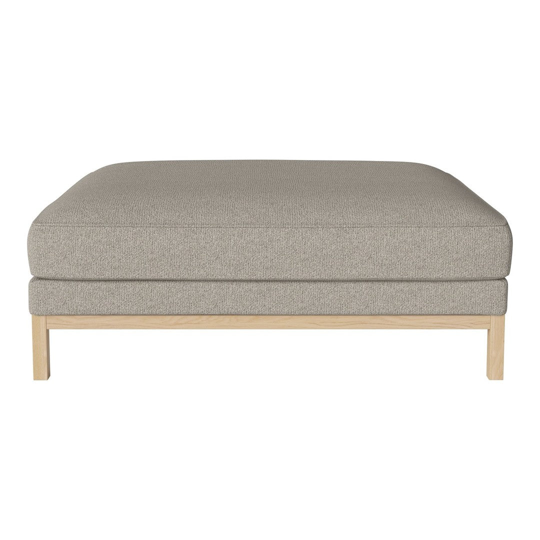 Light grey ottoman with a smooth, textured fabric and minimalist natural wood base. Perfect for modern decor.