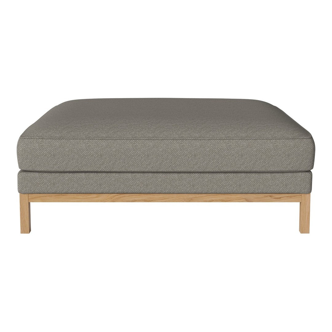 Gray upholstered ottoman with a smooth finish and a light wood base. Minimalist design perfect for modern decor.
