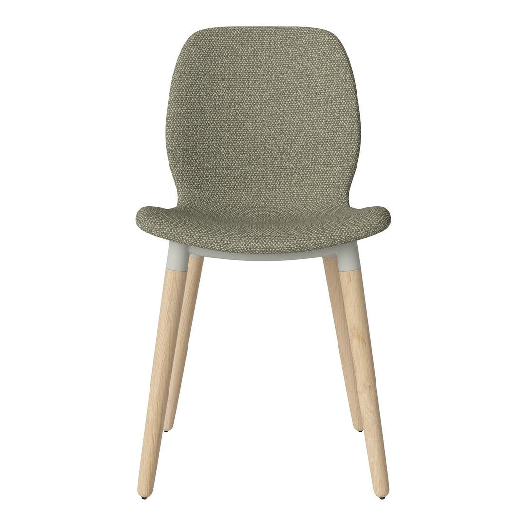 Olive green textured chair with natural wood legs, minimalist design for modern decor.