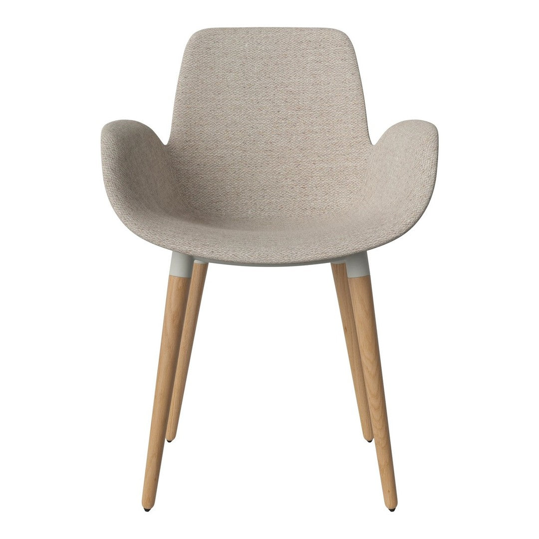 Beige upholstered chair with simple fabric texture and natural wooden legs. Ideal for modern decor.