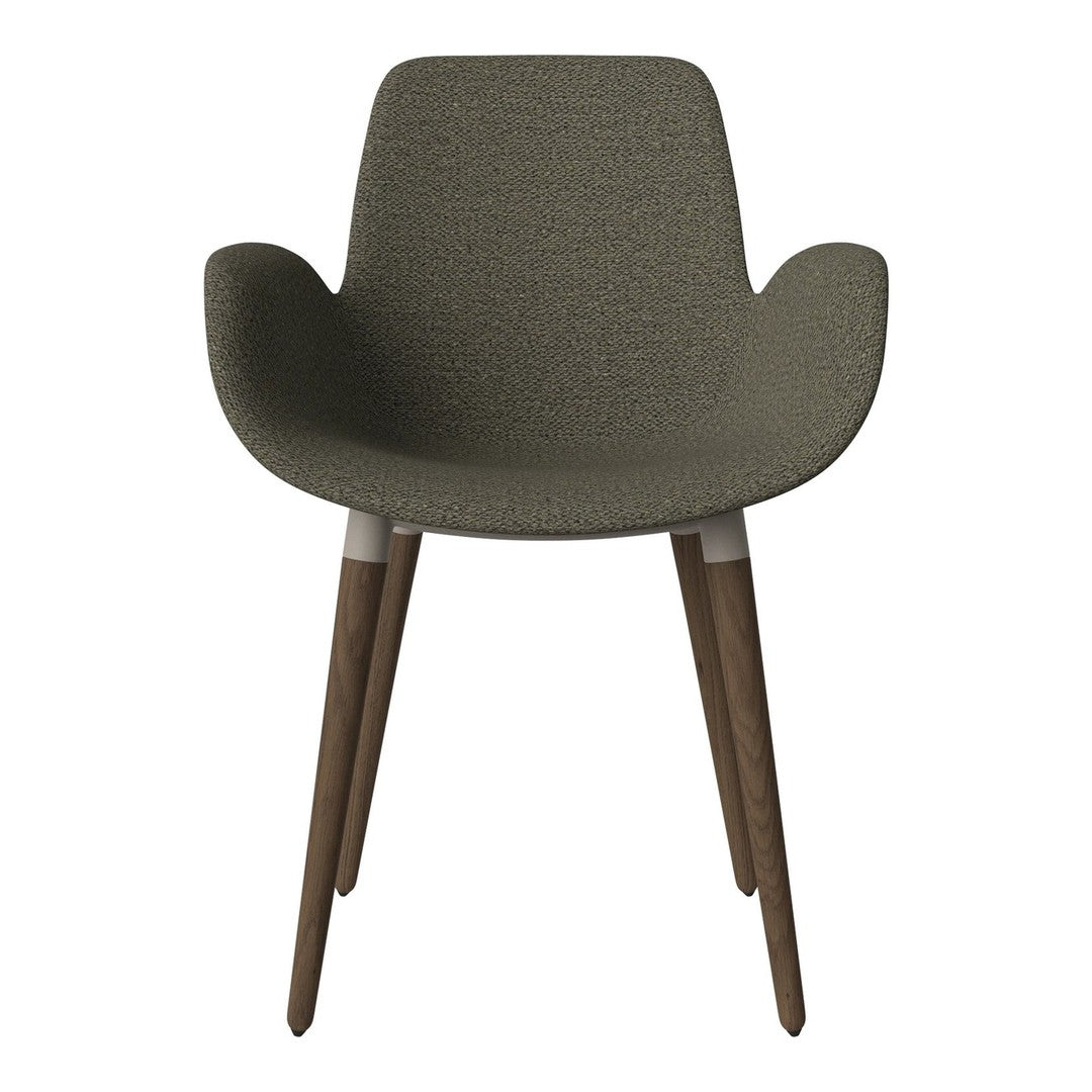 Olive green chair with textured fabric and natural wooden legs, combining modern style with a cozy feel.