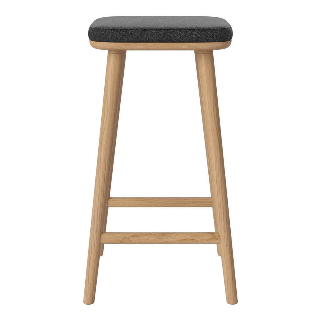 Black upholstered stool with natural wood legs and a smooth, simple design. Perfect for modern spaces.