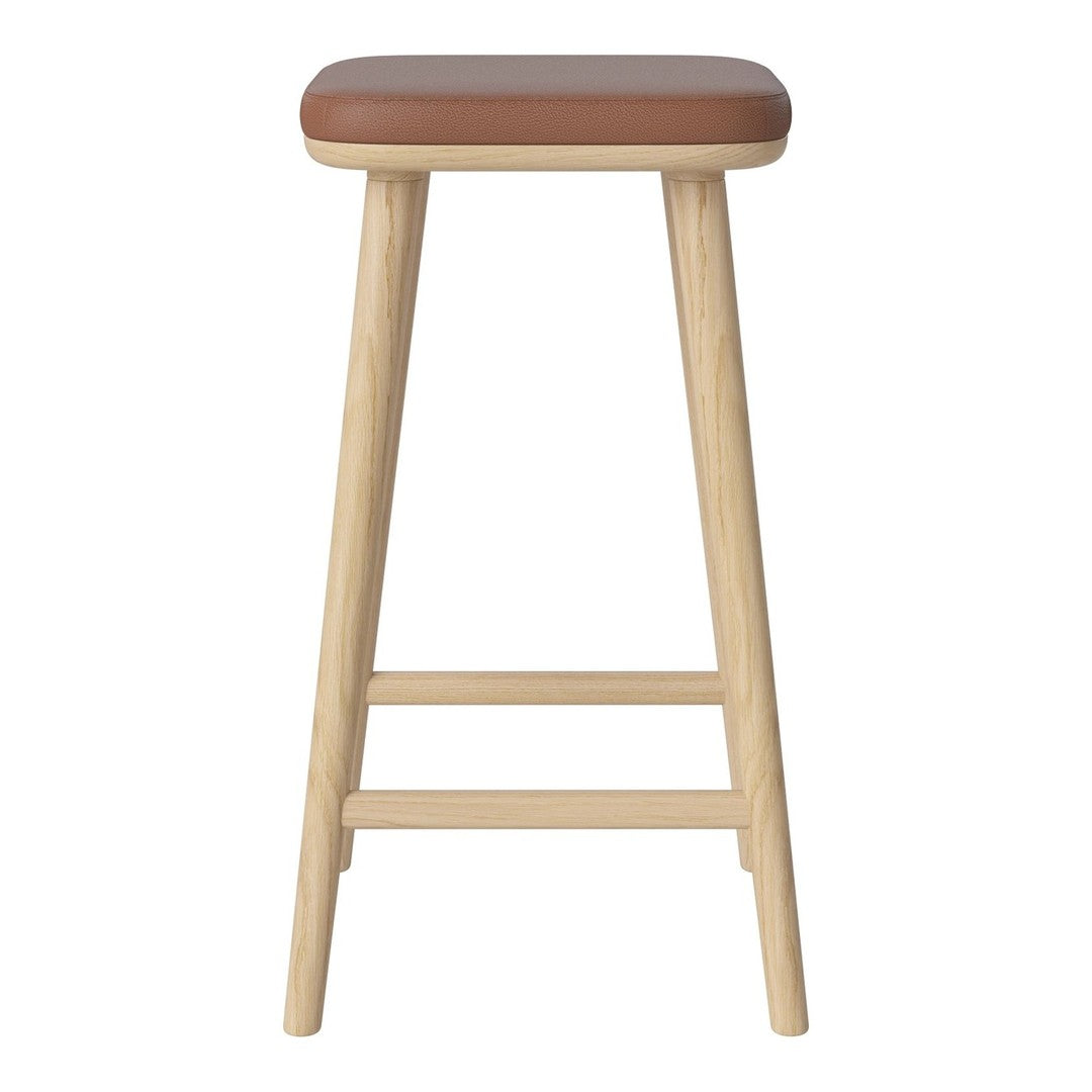 Tan upholstered seat with natural wood legs, featuring a minimalist design and smooth finish.