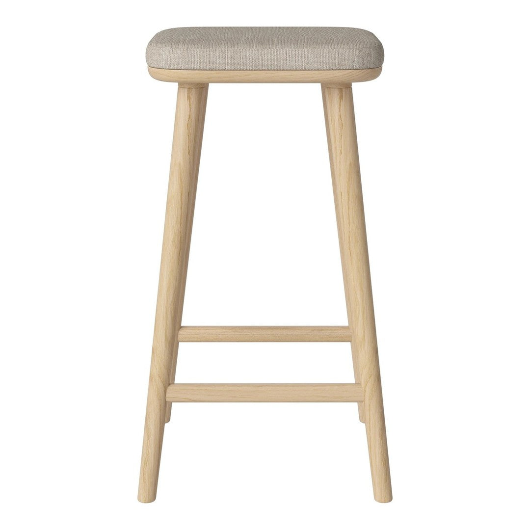 Light beige upholstered stool with natural wood legs, featuring a simple, modern design.