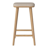Light beige upholstered bar stool with natural wooden legs. Simple, modern design ideal for various decor styles.