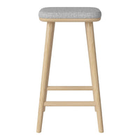 Light wood bar stool with a soft gray upholstered seat and clean, minimalist design.