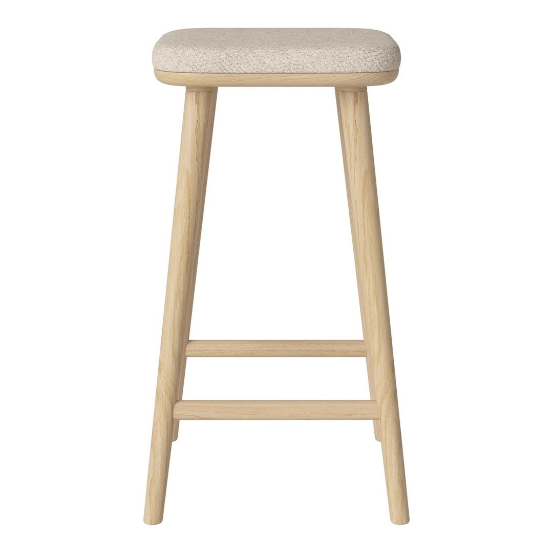 Light beige upholstered stool with natural wooden legs, featuring a simple and modern design.