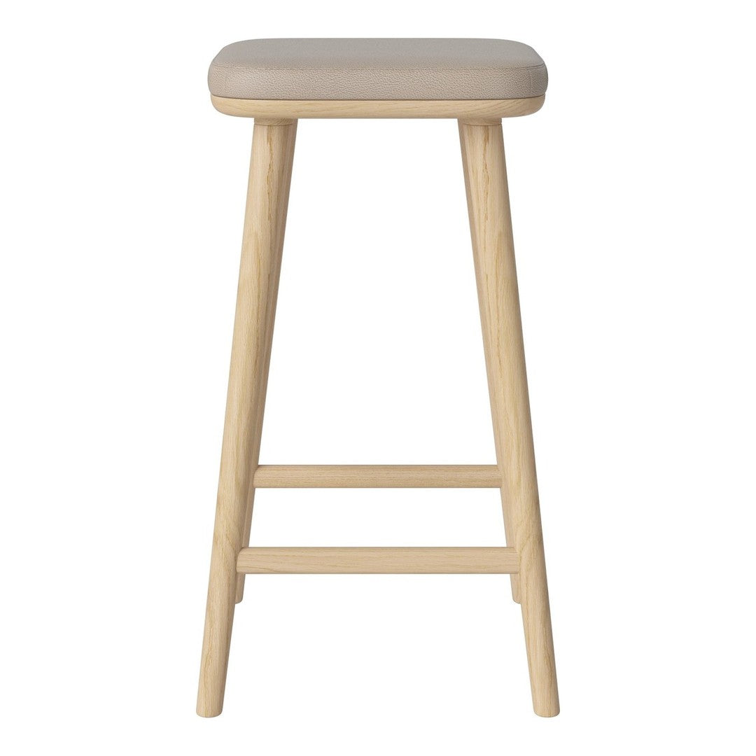 Light beige padded stool with natural wood legs, featuring a sleek, minimalist design. Ideal for modern decor.