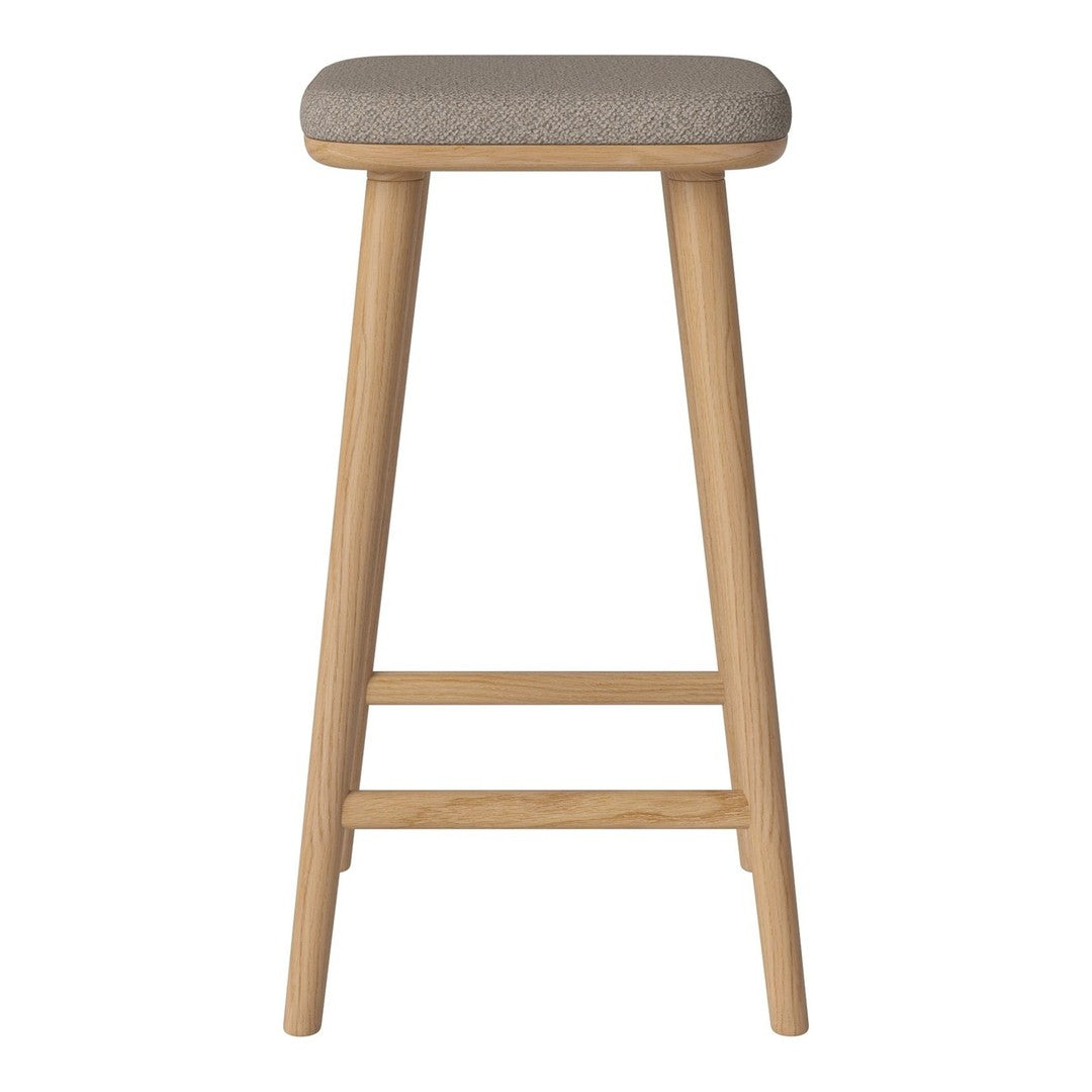 Gray upholstered stool with a natural wood frame and simple, modern design. Perfect for any contemporary space.