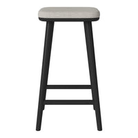 Black wooden stool with a light grey upholstered seat, featuring a sleek, modern design.