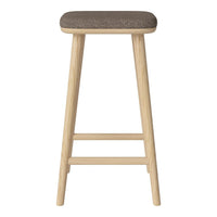 Light wood stool with a solid tan upholstered seat, featuring a sleek, minimalist design.