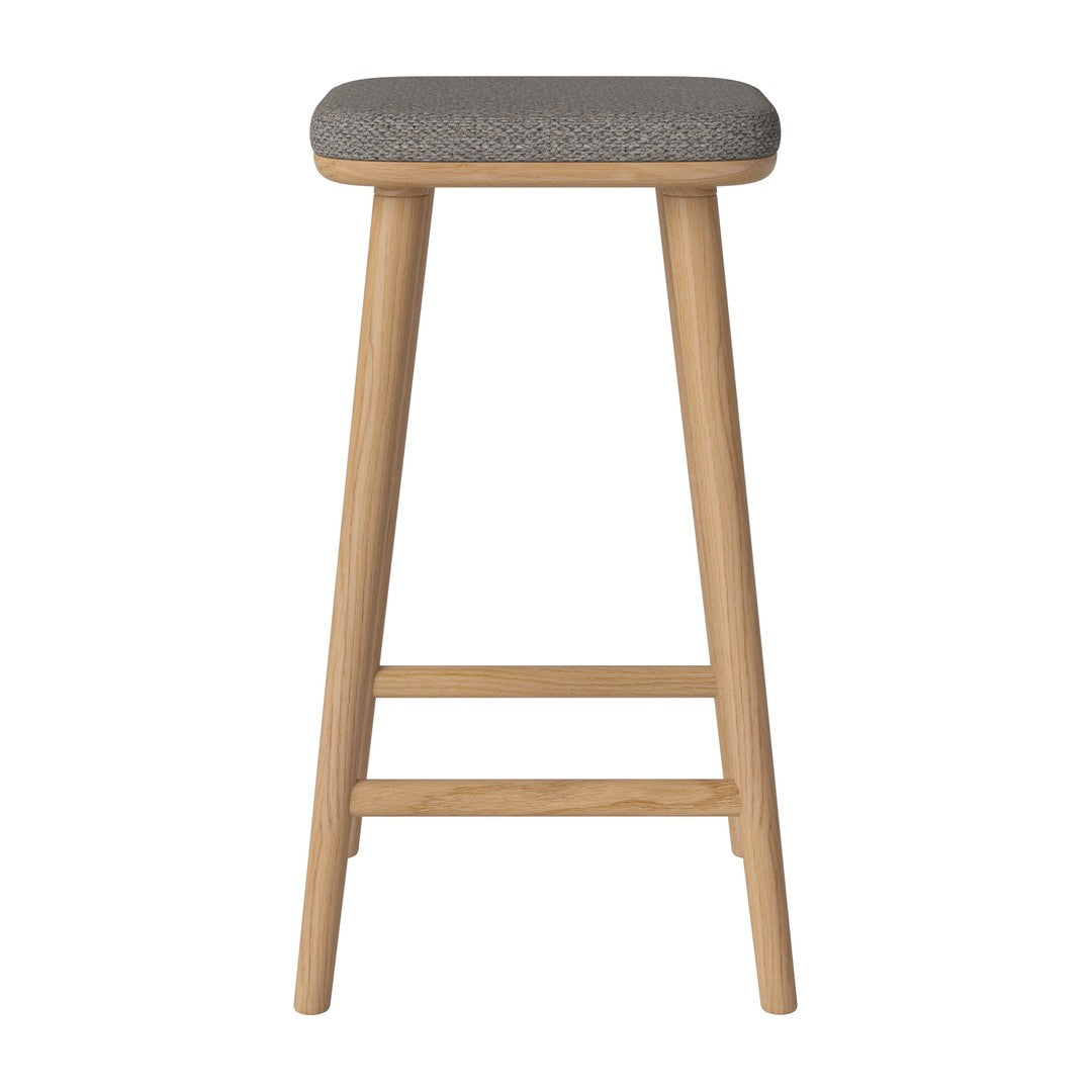 Gray upholstered seat on natural wood legs, featuring a simple, modern design with clean lines and minimalistic style.