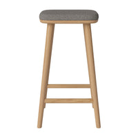 Gray upholstered seat on natural wood legs, featuring a simple, modern design with clean lines and minimalistic style.