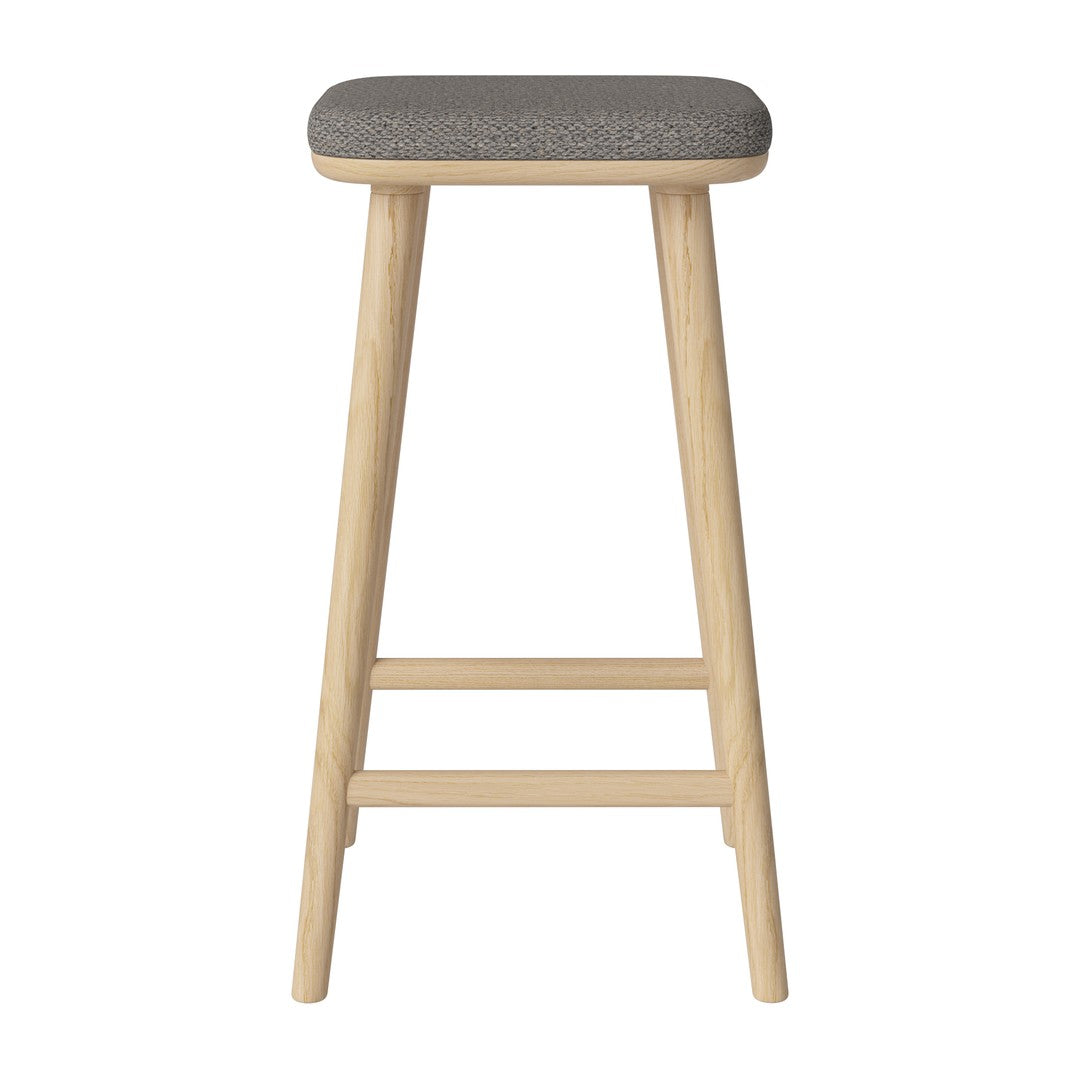 Gray patterned seat with light wooden legs, minimalist design for modern decor. Perfect for kitchens or bars.