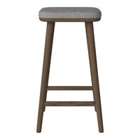 Gray upholstered stool with wooden legs, featuring a simple, modern design and subtle texture.