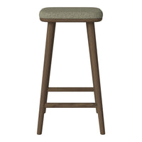 Brown wooden bar stool with a textured green fabric seat. Simple, modern design with a natural aesthetic.