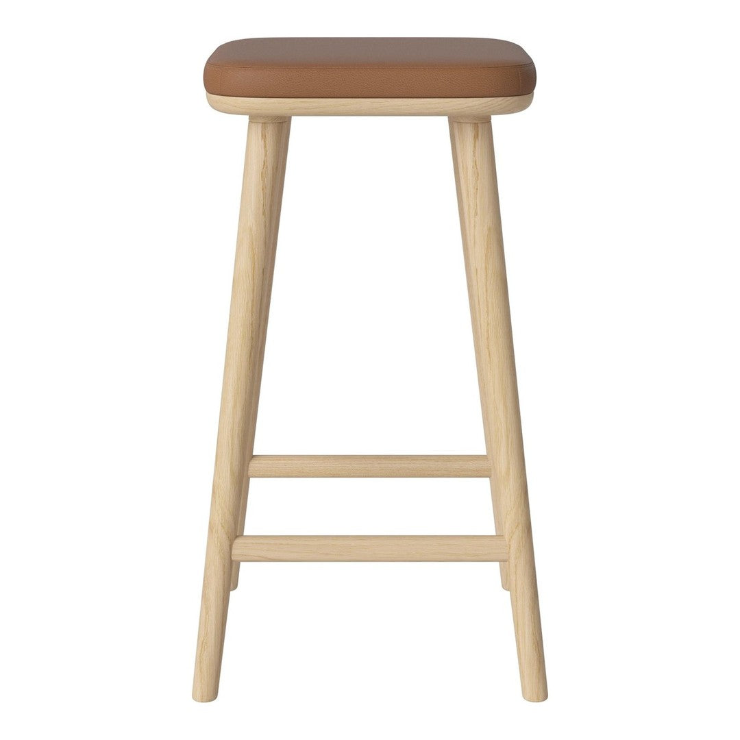 Tall wooden stool with a natural finish and a smooth, tan seat for a modern, minimalist look.