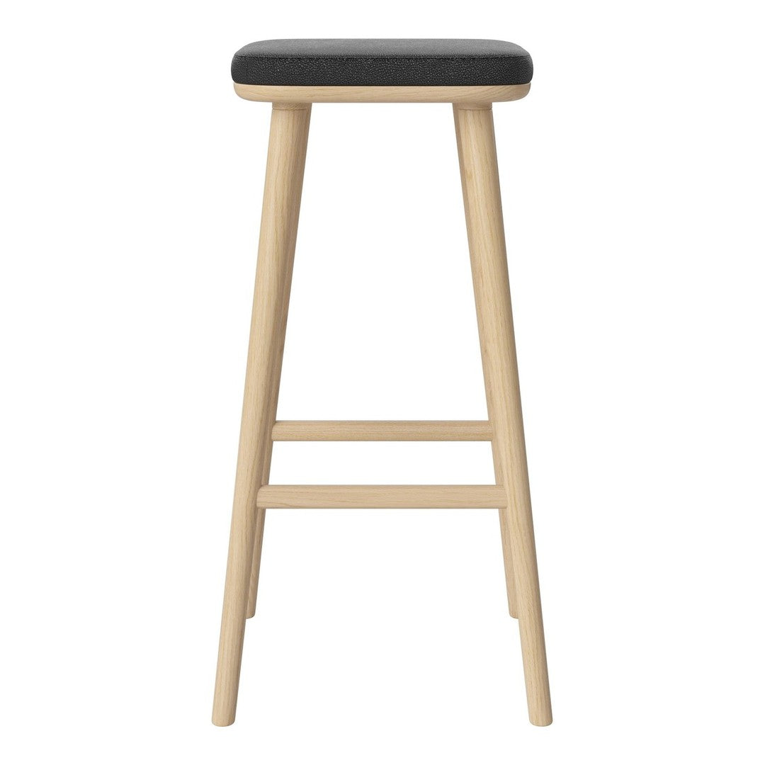 Light wood bar stool with a sleek black cushion seat, perfect for modern decor. Minimalist design with no patterns.