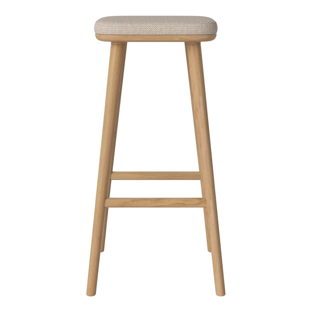 Light beige upholstered bar stool with natural wood legs, showcasing a minimalist design and soft texture.