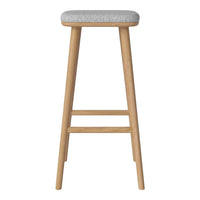 Light wood bar stool with a soft gray upholstered seat and simple, clean lines. Ideal for modern decor.