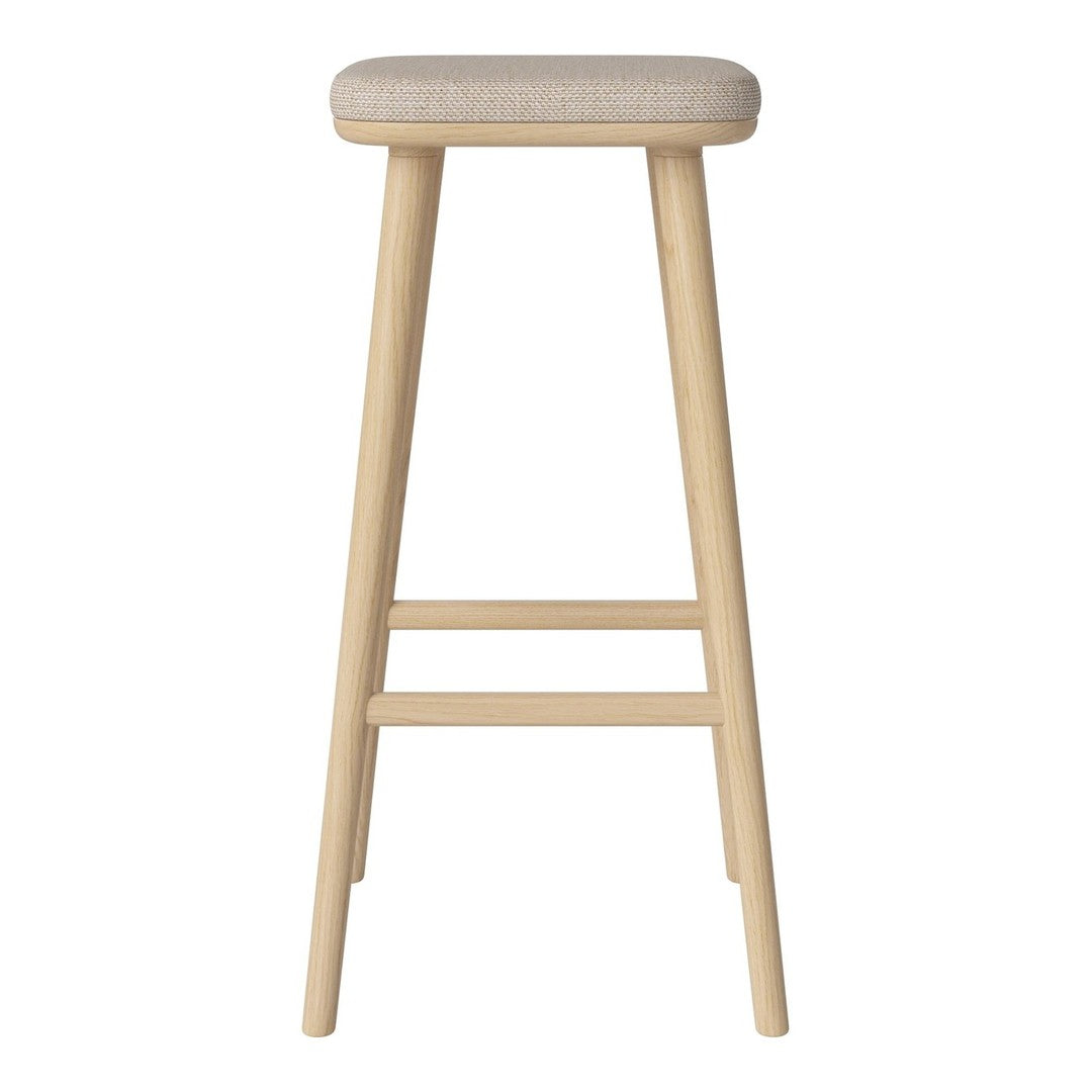 Light wood bar stool with a beige fabric seat, featuring a simple, clean design and natural finish.