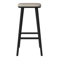 Black wooden bar stool with a light beige upholstered seat, featuring a simple, modern design.